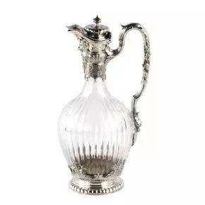 Silver wine jug in "16th century austere male dress." 