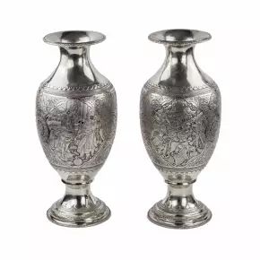 A pair of amphora-shaped Persian silver vases. 