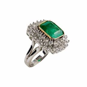 Platinum ring with emerald and diamonds. 