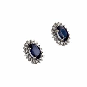 White gold earrings with blue sapphires and diamonds. 