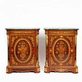 Paire de commodes decorees de marqueterie de style Louis XVI. 