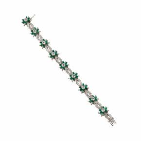Bracelet in platinum, emeralds and diamonds. 