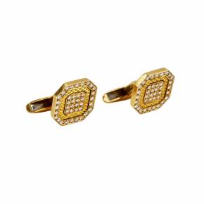 Gold Chopard cufflinks with guilloche and diamonds. 