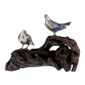Japanese silver figurines of wild pigeons on a wooden stand. Meiji period. 