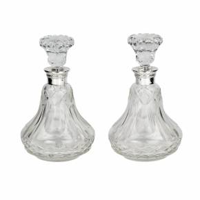 Pair of crystal, pear-shaped decanters with silver necks. 20th century. 