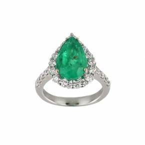 White gold ring with emerald and diamonds. ----