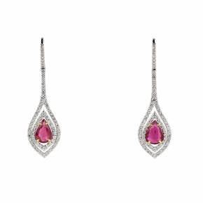 Long, 18K gold earrings with rubies and diamonds. 