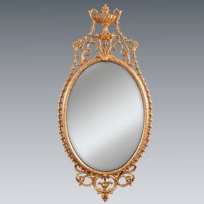 An elegant George III giltwood and carton-pierre oval pier glass, late 18th Century