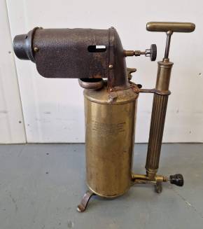 An antique kerosene blowtorch